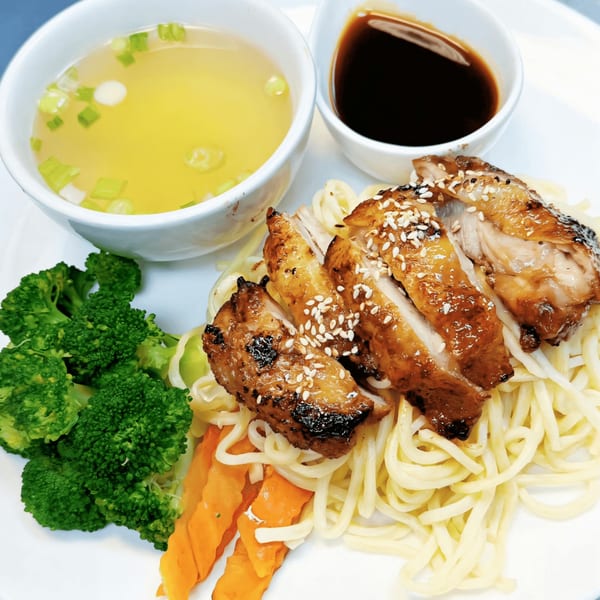 Thai Aroy Dee's grilled chicken with noodles, broccoli, carrots, soup, and dipping sauce.
